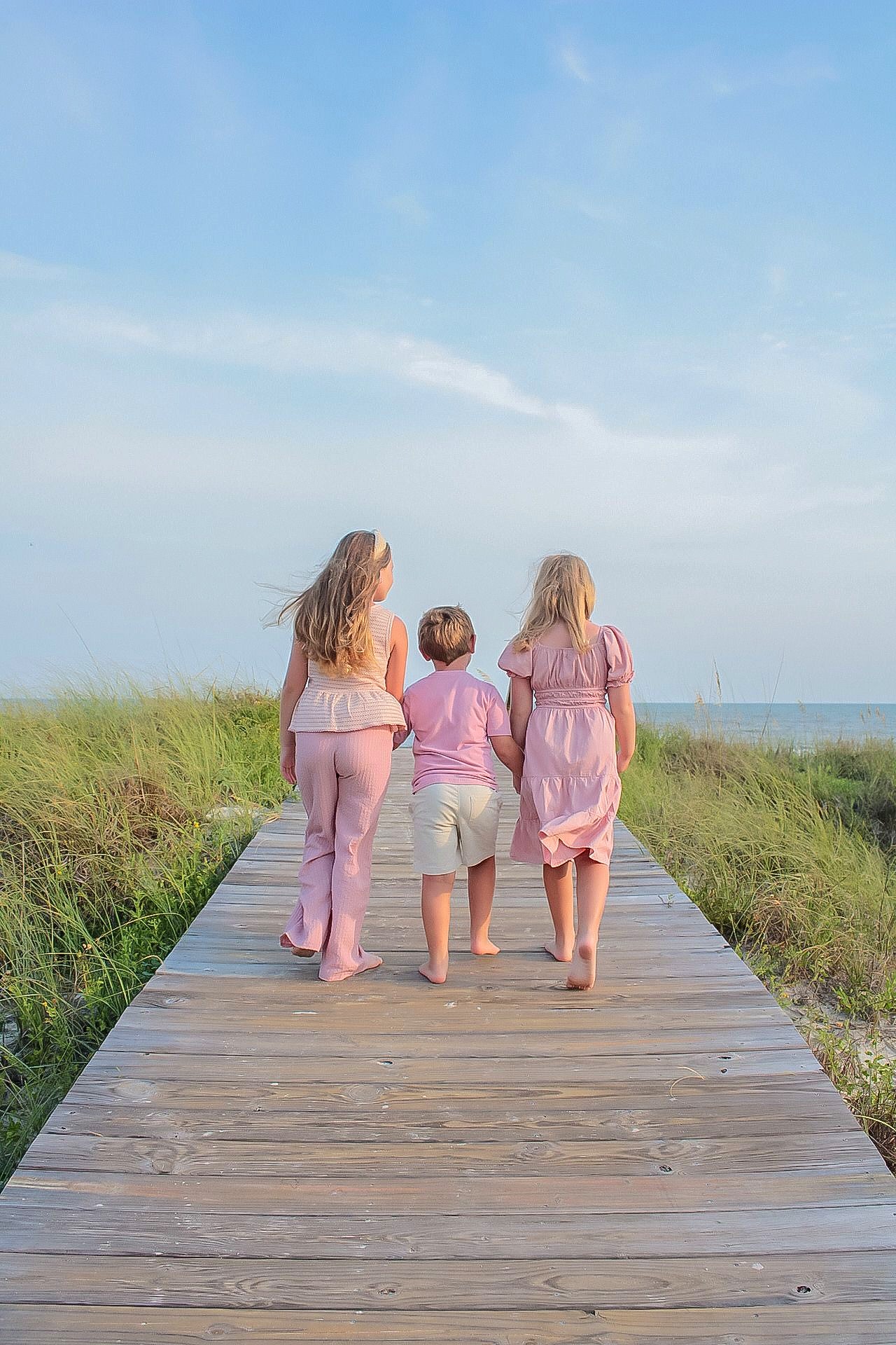 Children walking together toward the beach in Mexico Beach, Florida